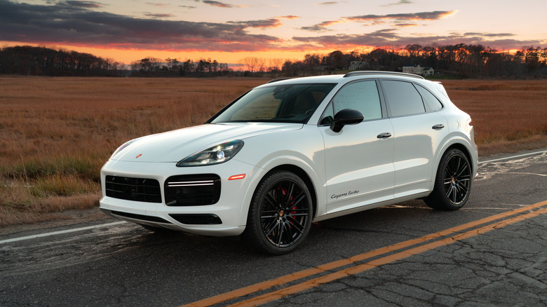 A white Porsche Cayenne Turbo on the highway