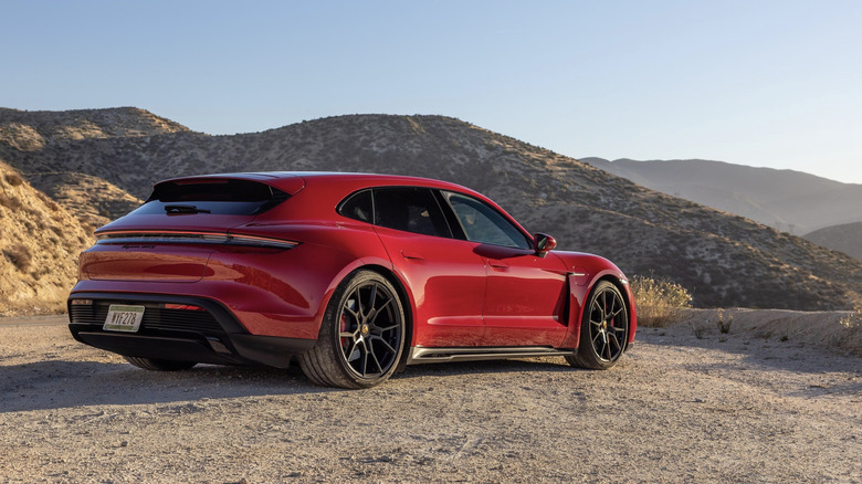 Rear 3/4 view of a red Porsche Taycan GTS Sport Turismo.