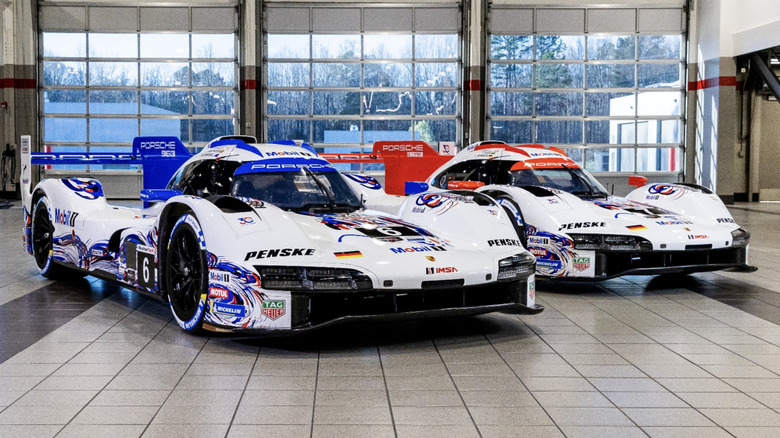The two current Porsche 963s in liveries inspired by the 1996 Porsche 911 GT1