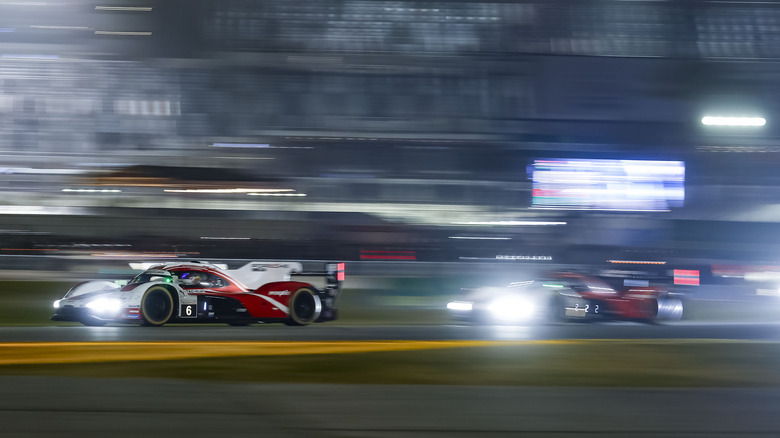 The No. 6 Porsche 963 leading the No. 7 Porsche 963 through the infield section at the Rolex 24 at Daytona