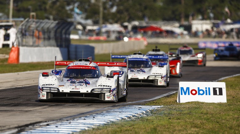 The No. 7 Porsche 963 leading the No. 6 Porsche 963 during the 12 Hours of Sebring