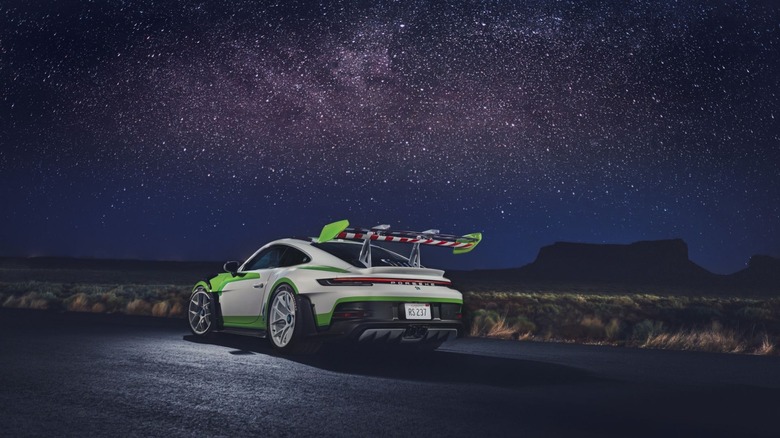 The Buzz Lightyear 911 GT3 RS sporting Buzz's wing, under a beautiful star-studded desert sky.