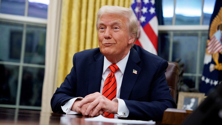 President Trump sitting at his desk in the Oval Office