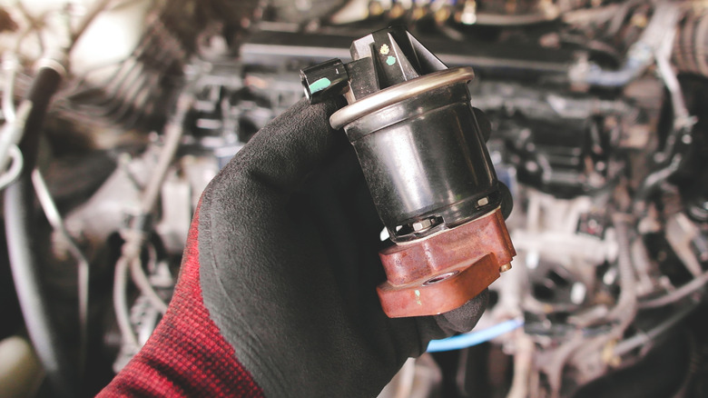 Mechanic holding EGR