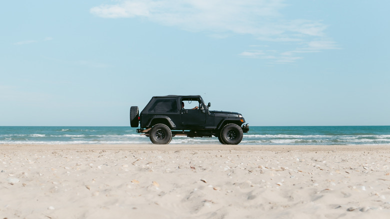 Black Jeep driving down South Padre Island