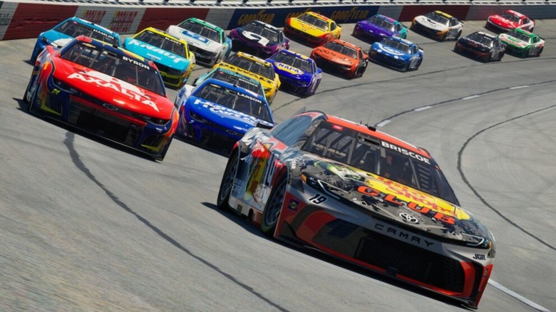 Cars ripping around a speedway in NASCAR 25.
