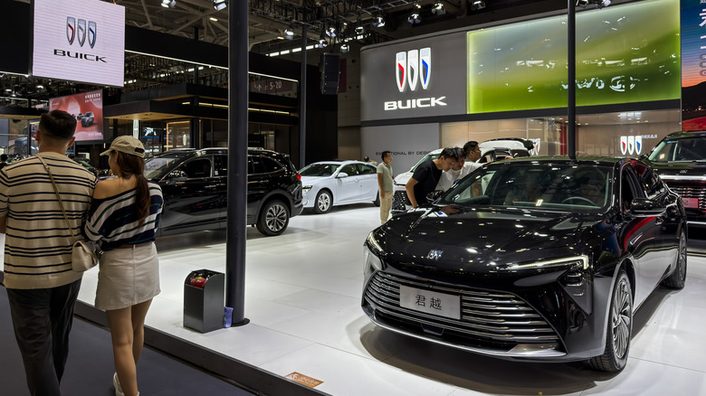 Visitors view vehicles at the Buick exhibition booth during the 30th Guangdong-Hong Kong-Macao Greater Bay Area Auto Show on June 3, 2026, in Shenzhen, Guangdong Province, China.