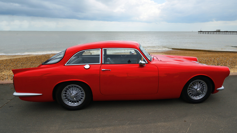 Red Peerless GT parked atseaside