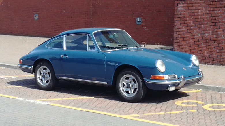 A blue 1967 Porsche 912 parked on a street