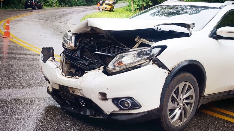 Wrecked car in the middle of the road