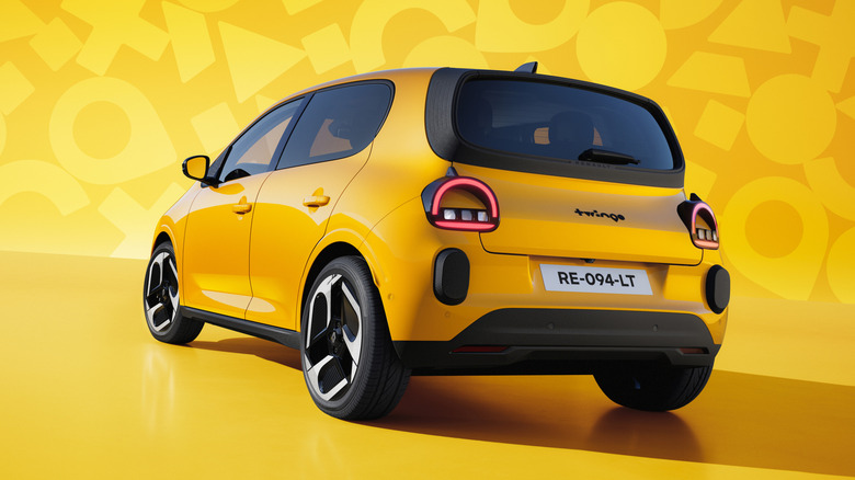 Rear 3/4 view of a yellow Renault Twingo