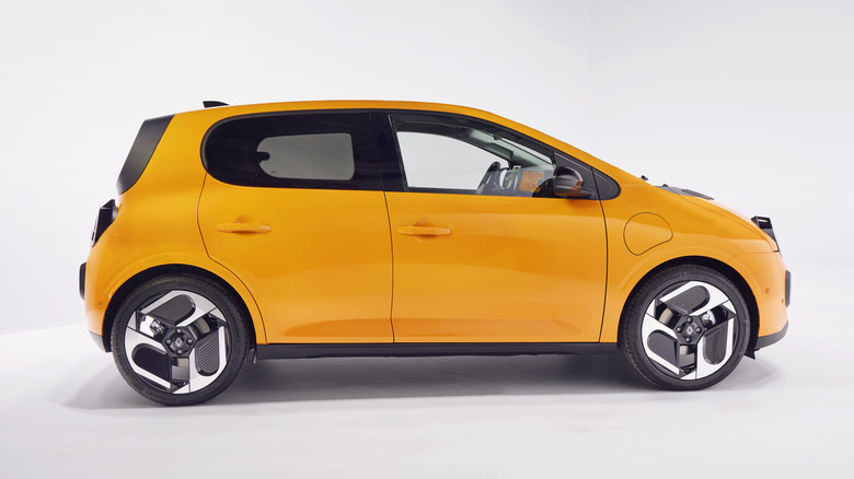 Side view of a yellow Renault Twingo E-Tech