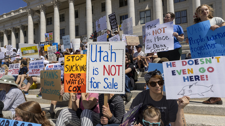 Protesters hold signs in front the of the Utah State Capitol building to oppose the construction of the Stratos data center in Box Elder County on May 23, 2026 in Salt Lake City, Utah. The proposed data center would be about 40,000 acres and is speculated to use 9 gigawatts of power.