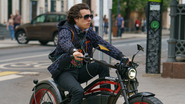 A motorcycle rider with earphones while driving