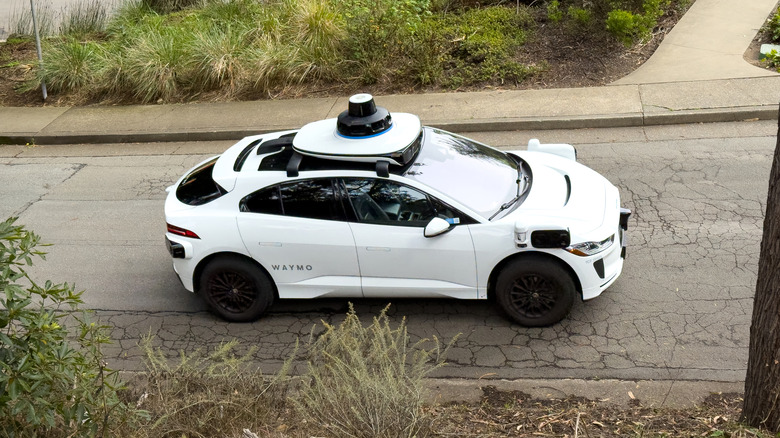 Side view of a Waymo robotaxi on a hilly San Francisco street