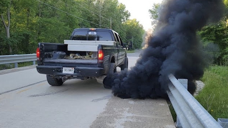 Ford truck rolling coal