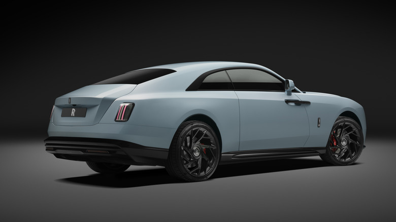 Rear 3/4 view of a blue Rolls-Royce Spectre Series II Black Badge