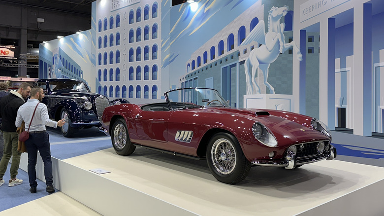 A red Ferrari 250 GT California Spyder at R&eacute;tromobile Paris 2023