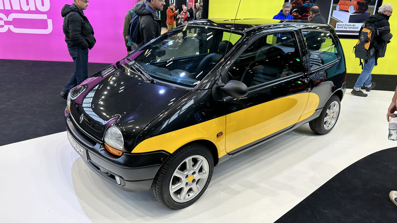 A black and yellow Renault Twingo at Rétromobile Paris 2023
