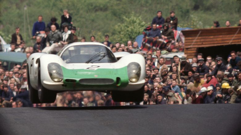 Porsche 908 catching air while racing