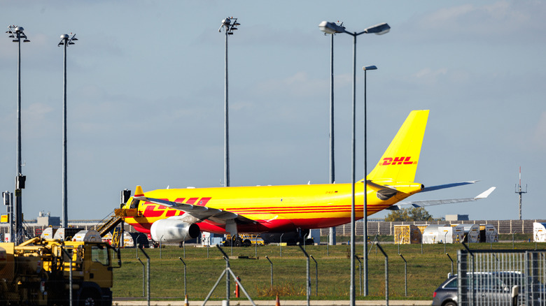 A cargo airplane of the DHL package delivery company stands on the tarmac at Leipzig/Halle Airport on October 15, 2024 in Schkeuditz, Germany.