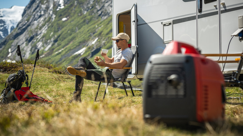A camper using a gasoline generator