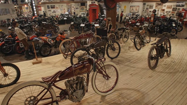 A reconstruction of a stretch of boardtrack with antique motorcycles
