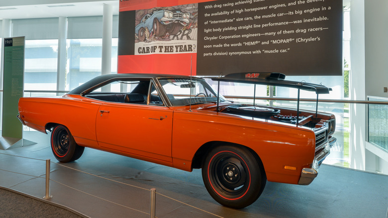 The Walter P. Chrysler Museum lobby showing a muscle car with the hood lifted.