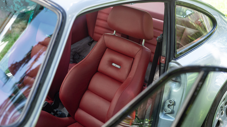 Red Recaro bucket seat inside a classic Porsche