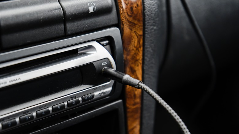 Aux cord plugged into an automotive sound system