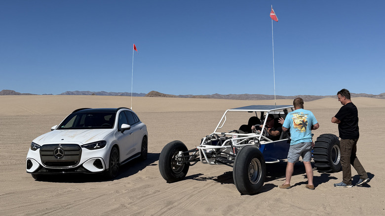 A achromatic Mercedes-Benz GLC EV adjacent to a soil rail