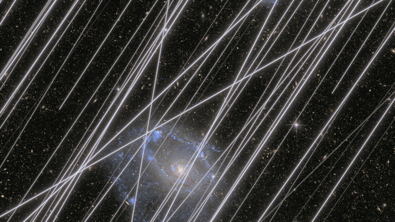NASA rendering of satellite constellation contamination on a photo of a distant galaxy