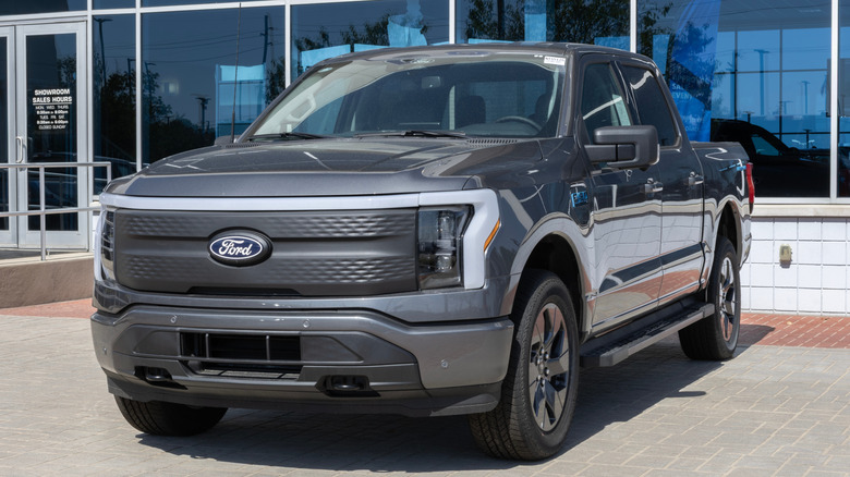 Fishers - September 28, 2025: Ford F-150 Lightning 4X4 Supercrew EV display. Ford offers the F150 Lightning with up to 320 miles of driving range. MY:2025