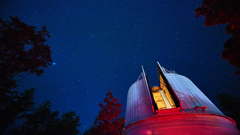 The Lowell Observatory successful Arizona, shown astatine nighttime nether a star-filled sky