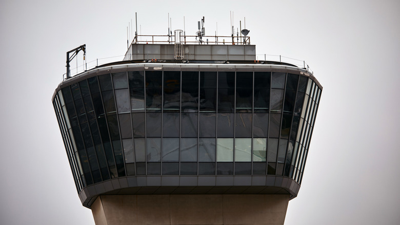 An airport control tower is seen at Terminal C in Newark Liberty International Airport, on May 6, 2025 in Newark, New Jersey. Passengers traveling to, from, or through Newark Liberty International Airport (EWR) have experienced several days of delays and cancellations caused by air traffic control staffing shortages and equipment malfunctions.