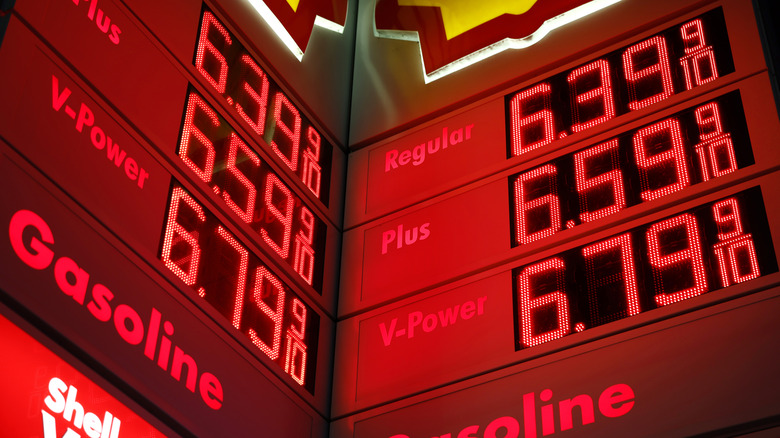 two gas price boards showing a gallon of regular above $6 in California