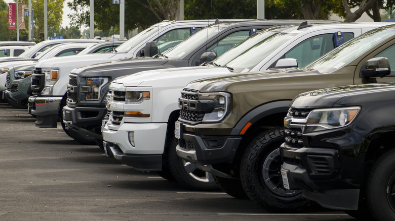 Full-size trucks for sale are parked at a CarMax dealership on November 11, 2025 in San Diego, CA.
