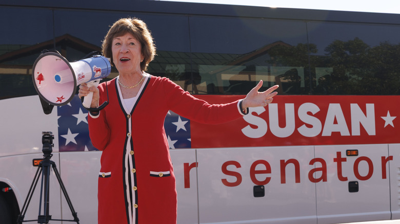 Susan Collins speaks in front of her campaign bus