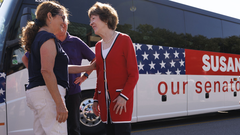 Susan Collins in front of her campaign bus