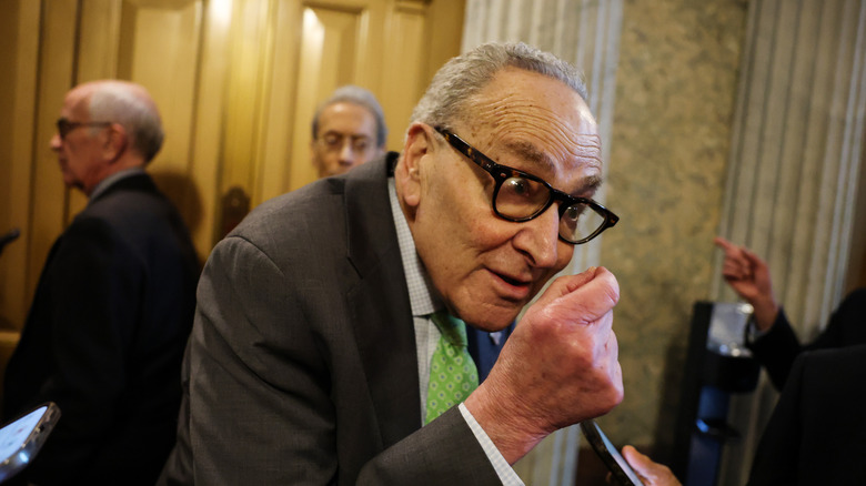 Senate Minority Leader Chuck Schumer (D-NY) speaks to reporters outside of the Senate Chambers during a vote at the U.S. Capitol Building on March 12, 2026 in Washington, DC.