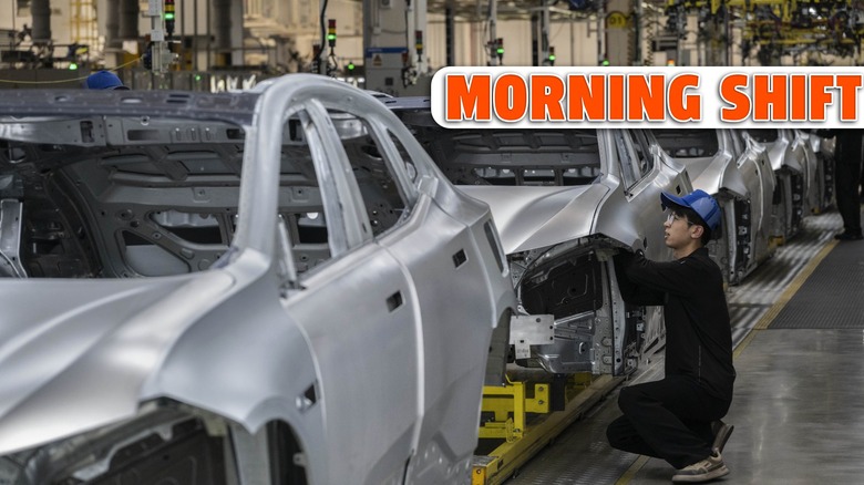A worker checks the frame of a car on the production line for electric vehicle maker Zeekr at its factory on May 29, 2025 in Ningbo, China.