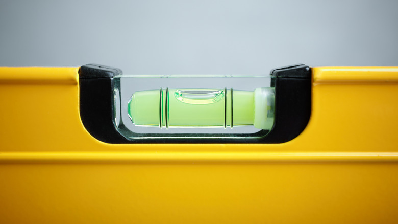 A yellow bubble level for construction
