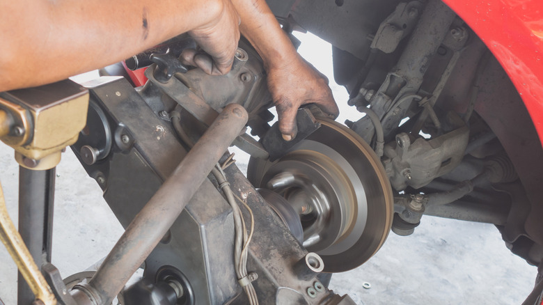 A mechanic doing some brake rotor resurfacing