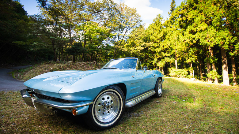 A '60's Corvette Stingray in blue with side pipes