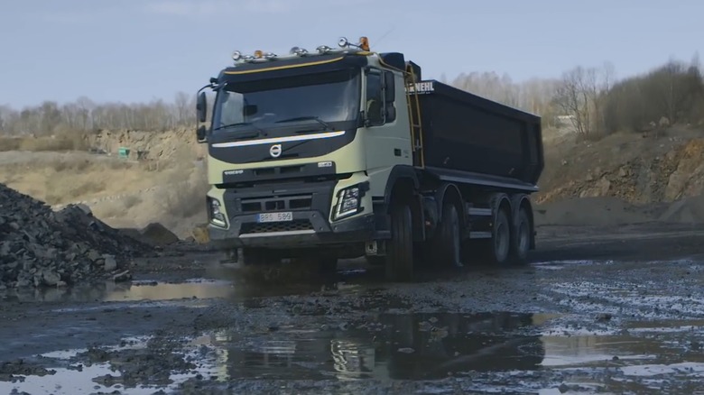 A Volvo truck with dual-steer front axles