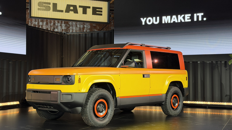 Front 3/4 view of a yellow and orange Slate SUV