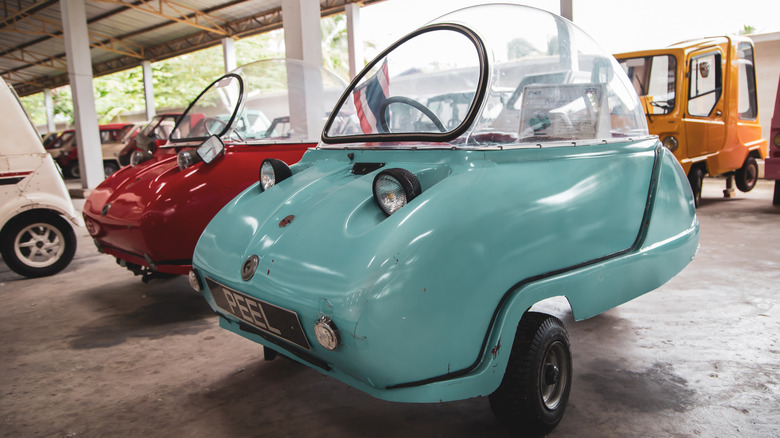 Vintage microcar Peel Trident exhibit at vintage car collector garage in Nakhon Pathom province.