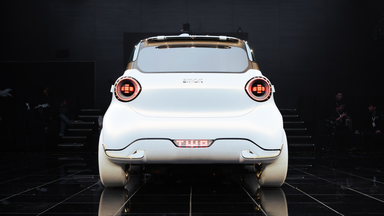 A rear-shot of the white #2 concept in a black studio