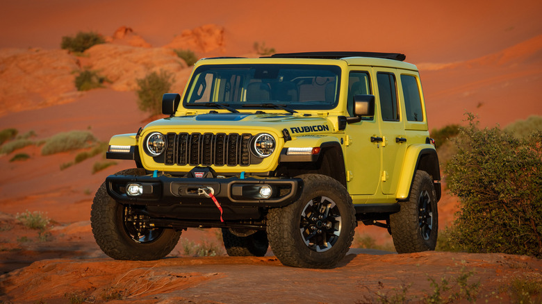 Yellow 2024 Jeep Wrangler 4xe parked in the desert