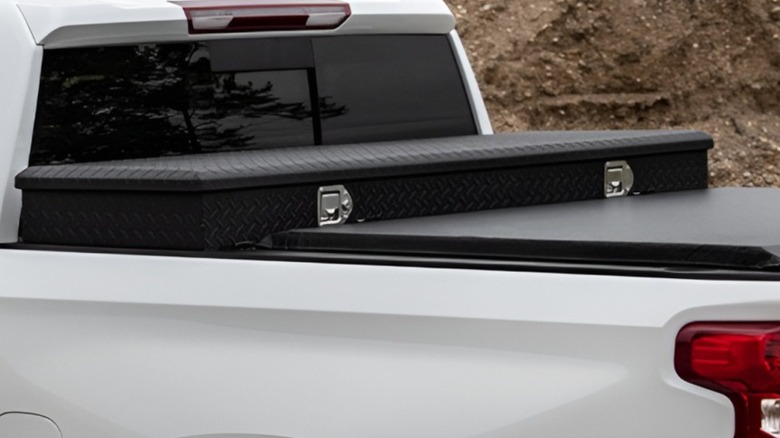 A pickup bed tool box and folding tonneau cover